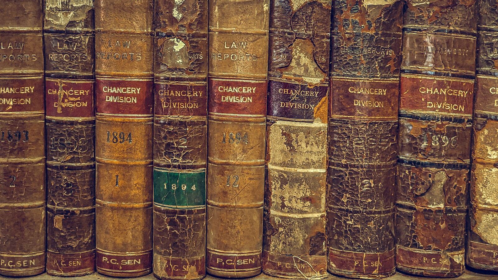 A shelf of worn nineteenth-century Law Reports volumes